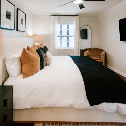 Relax in a calm, curated bedroom designed for dreamy nights.