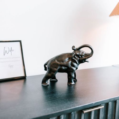 Details that make you feel at home. Our cozy space is filled with thoughtful touches — like this charming elephant and easy access to WiFi — making your stay stylish, connected, and unforgettable.