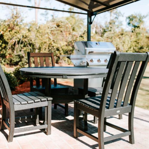 Gather, grill, and chill in this breezy backyard dining space.