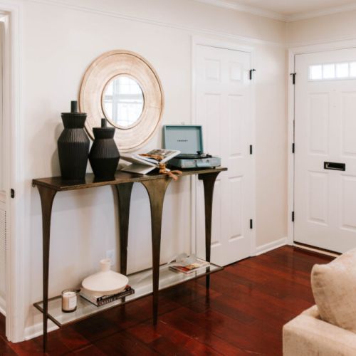 Warm, stylish entryway with thoughtful touches to welcome you home in comfort.