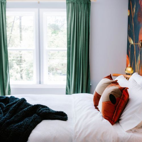 Bask in natural light, bold design, and cozy comfort—your serene retreat with an artistic twist awaits!