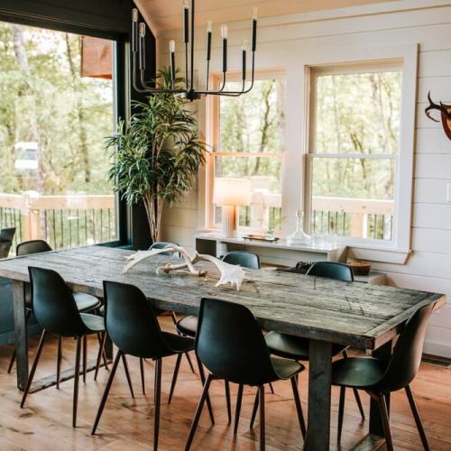 The hand-crafted dining table can seat up to eight, and there are also five seats available at the extended kitchen bar.