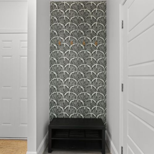 Drop your bags and kick off your shoes—this chic little nook makes a bold first impression with its stunning wallpaper and functional flair.