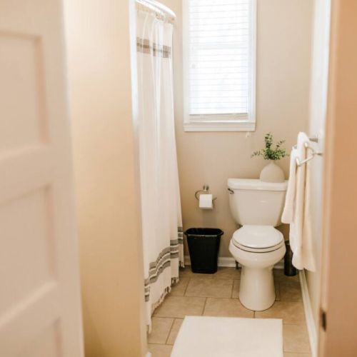 Every detail considered: this bathroom comes stocked with toilet paper and towels