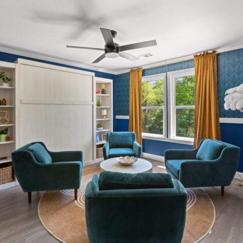 This stylish sunlit lounge blends glam decor with cozy vibes—perfect for morning coffee, game night, or an impromptu photoshoot!