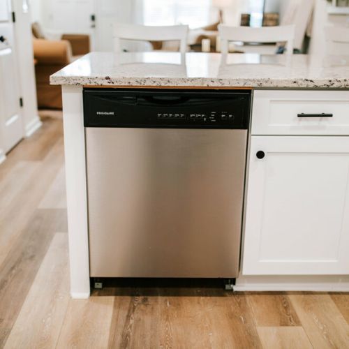 Simplify your kitchen routine with the Frigidaire dishwasher, blending seamlessly into this modern kitchen