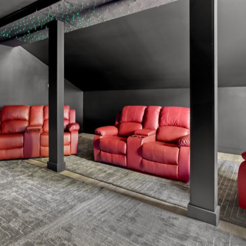 Kick back in plush recliners, dim the lights, and enjoy a cinematic experience without ever leaving the house!