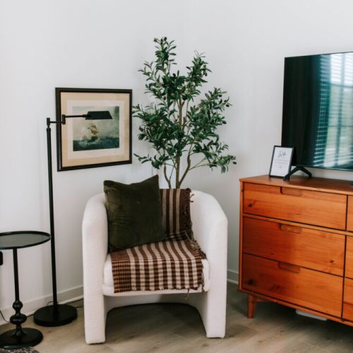 Cozy corner goals. Curl up with a good book or unwind after a day of exploring — this thoughtfully designed nook is the perfect blend of comfort and style.