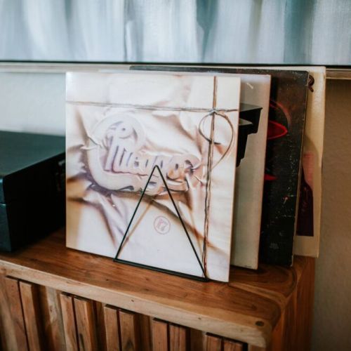 Record player with bluetooth speaker and record collection.