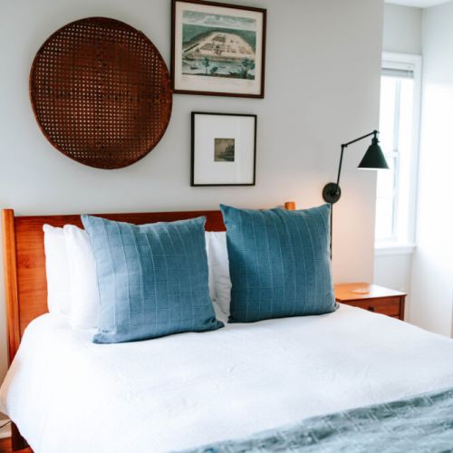 Bask in the natural light of this airy bedroom, where calming tones, plush textures, and curated vintage touches create the perfect space to rest and recharge.