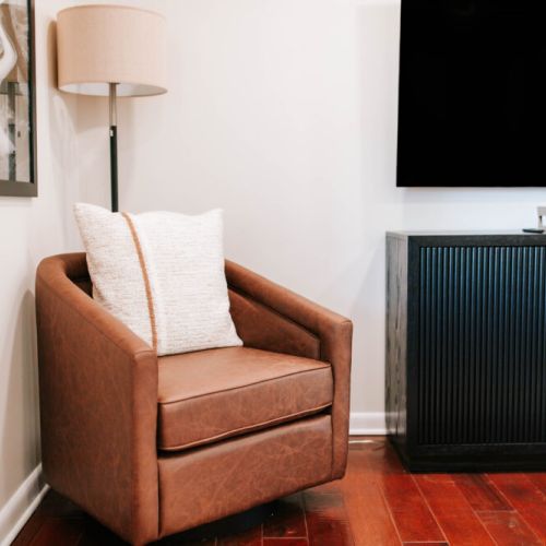 Warm, inviting reading nook that blends comfort, texture, and modern simplicity.