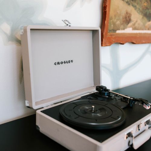 Tucked within the home office, Perfect for getting lost in a good book or enjoying the warm crackle of your favorite vinyl on the Crosby record player.