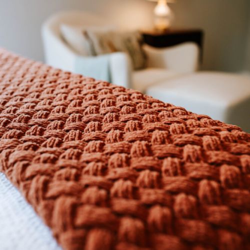 Layered in comfort. Our textured throws add a warm, inviting touch to your stay—perfect for slow mornings or evening wind-downs.