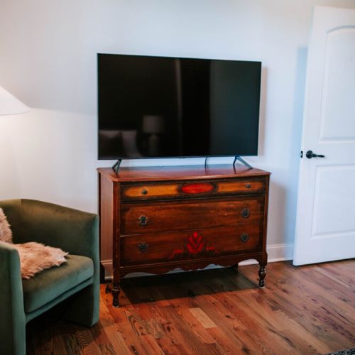 Unwind in comfort and style in our bedroom,  with a flat-screen TV for your entertainment.