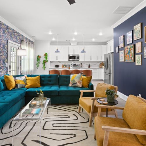 Gather, laugh, and unwind in this vibrant open-concept space—where modern style meets cozy comfort.