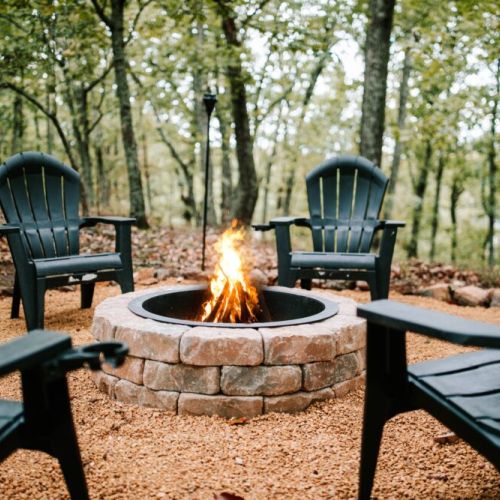 Gather around the fire and unwind under the trees.