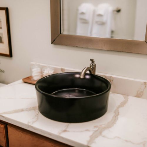 Indulge in luxury! Our full bathroom features a luxe walk-in shower, stocked with spa-quality Public Goods amenities for a pampering experience.