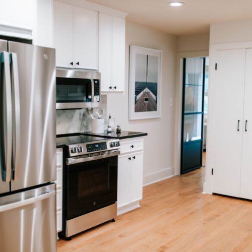 Fully equipped kitchen with stainless steel appliances and plenty of storage space.