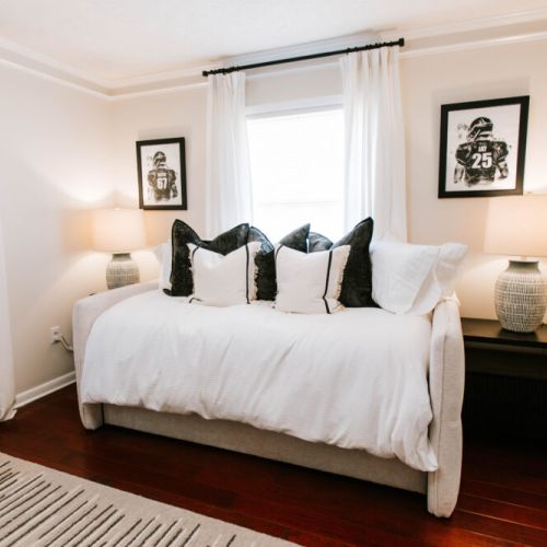 Stylish daybed with trundle—plush, bright, and perfect for relaxing stays.