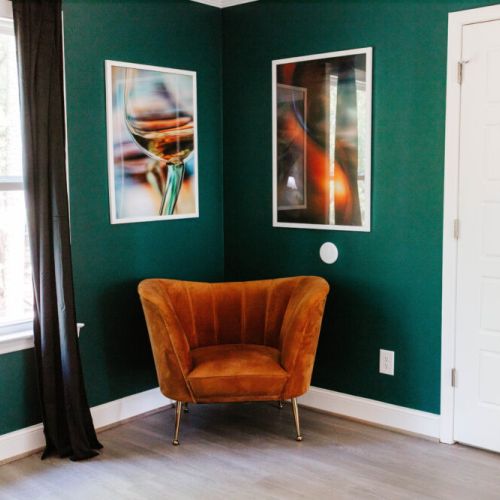 Curl up in this luxe velvet chair with a glass of wine and your favorite book—where modern art and cozy vibes collide!