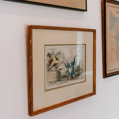 Charming touches of history on every wall — unique vintage prints and maps add character and a story to your stay.