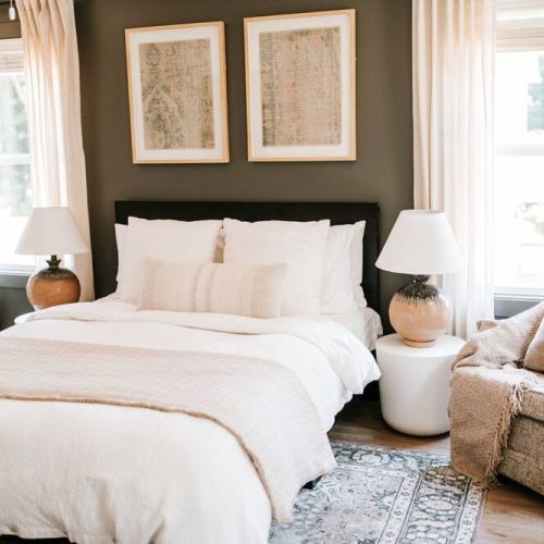 Sleep in luxury: the primary bedroom on the second level boasts an en-suite bathroom and features a queen-sized Purple mattress and Organic Supima Cotton Linens, ensuring a restful and comfortable night's sleep.