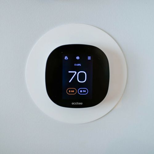 Effortlessly control the cabin's temperature with this Ecobee thermostat controller.