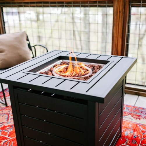 Stay warm and cozy! Our cabin boasts a propane fire table, perfect for gathering around and enjoying the evening outdoors.