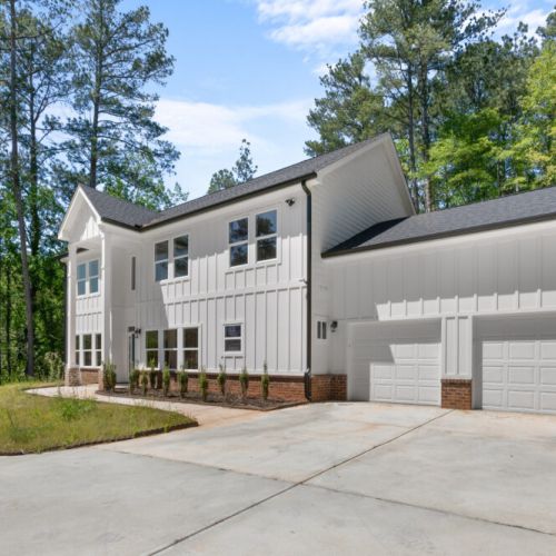 Tucked at the edge of the woods, this stunning white farmhouse offers luxury, peace, and privacy. With sleek style, spacious interiors, and nature right outside your door, it's the perfect escape for families, friends, or creatives looking to unwind