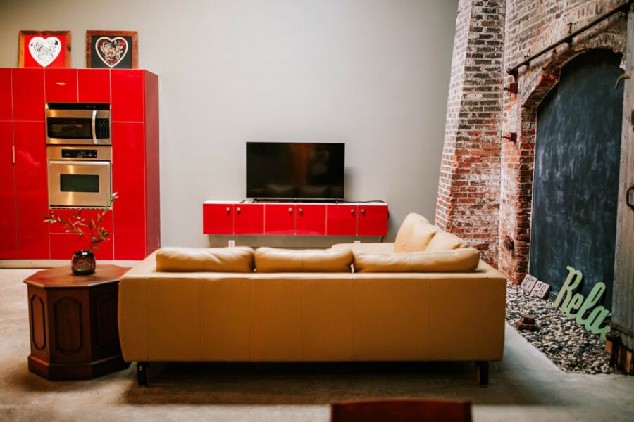 Step into this eclectic artist’s loft in the heart of the arts district, tucked inside the Chase Street Warehouses. Not your average apartment – it’s filled with one-of-a-kind local artwork and endless creativity!