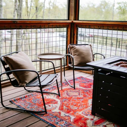 Our cabin offers its own outdoor sanctuary for guests. Breathe in the mountain air from the porche or unwind by the outdoor propane fire table. With ample seating areas, guests can sip morning coffee or enjoy a sunset drink. A large outdoor dining table invites al fresco meals.