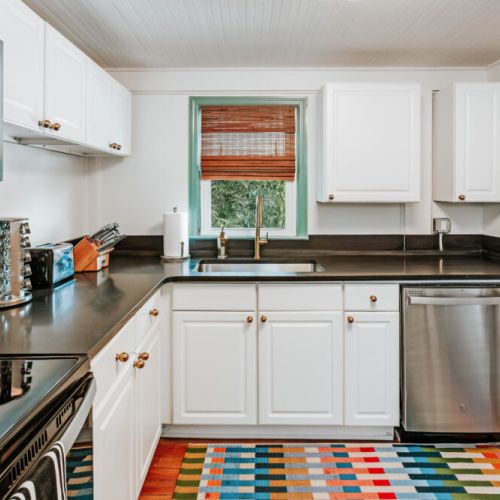 Cook, snack, and settle in with ease in this bright kitchen featuring stainless steel appliances, generous counter space, and plenty of cabinetry. Whether it’s breakfast before exploring or dinner at home, everything feels close at hand.