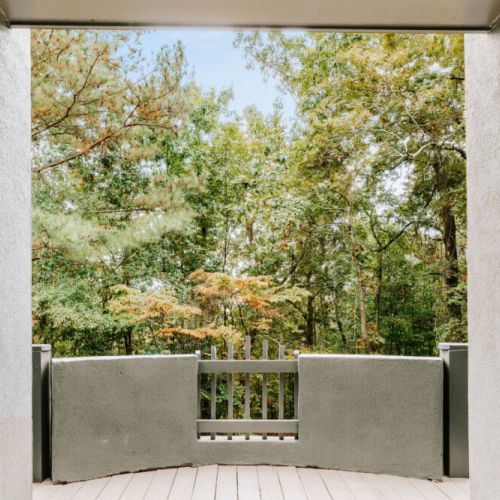 Step onto your private balcony and take in stunning views of the lush forest, a perfect spot to breathe and unwind.