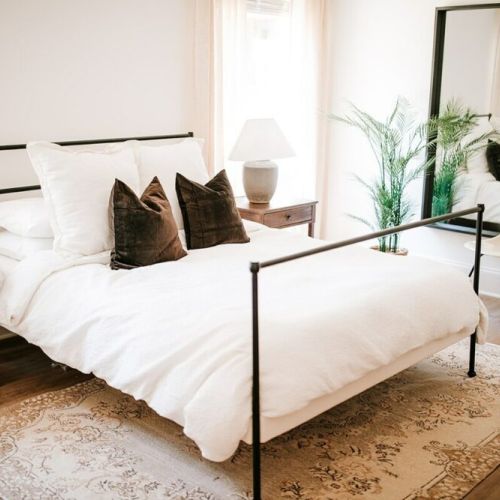 Style and comfort meet: the main floor bedroom offers a queen bed and full-length mirror, while featuring a Purple mattress and Organic Supima Cotton Linens in all bedrooms for a luxurious stay.