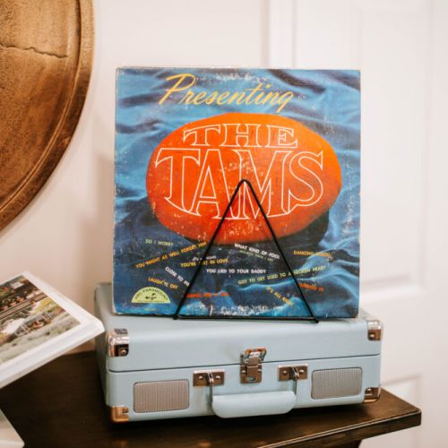 Classic vinyl touches add charm and a nostalgic vibe to enhance your stay.