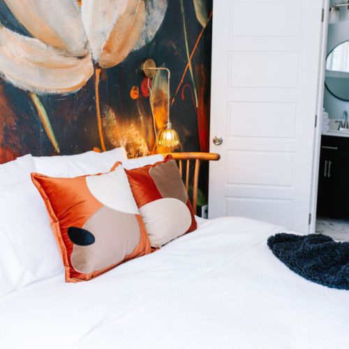 This cozy suite blends botanical beauty with spa-like serenity—featuring a dreamy bed and a sleek private bath just steps away.