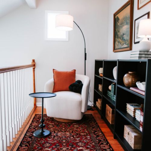 Tucked away at the top of the stairs — a quiet little landing made for page-turners, tea-sippers, and slow Sunday mornings.