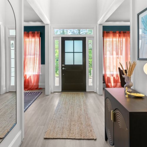 This bright and chic entryway welcomes you with bold colors, modern flair, and feel-good vibes from the very first step. Your unforgettable stay starts here!