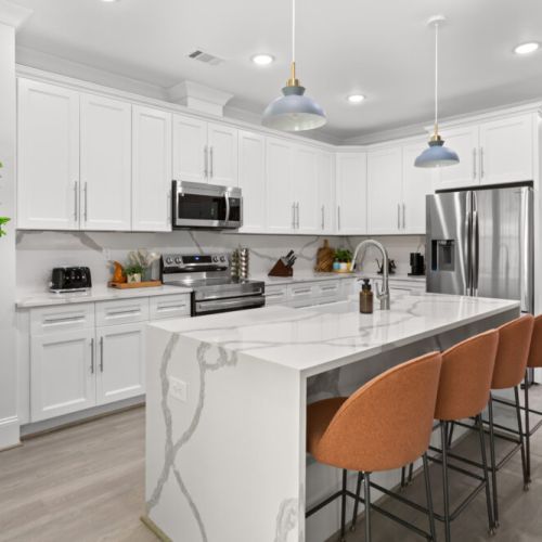 Cook, sip, and connect in this stunning modern kitchen featuring luxe marble countertops, stainless steel appliances, and cozy bar seating perfect for morning coffee or evening cocktails. Whether you're a foodie or just here for the vibes, this space has everything you need to feel right at home.