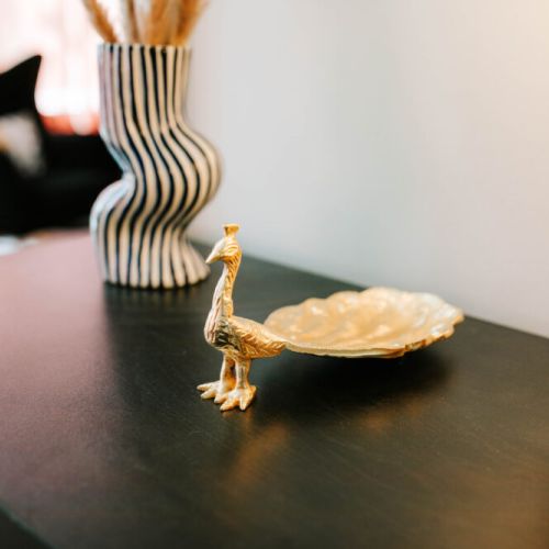From playful curves to luxe gold accents, every corner of this space is thoughtfully styled to make your stay feel effortlessly elegant.