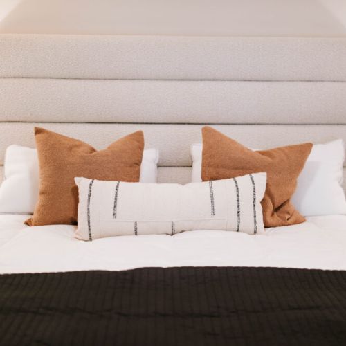 Every detail invites relaxation — from the layered pillows to the soft textures, this bed is styled for both elegance and a perfect night’s sleep.