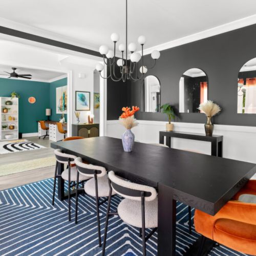 Host unforgettable dinners in this bold, stylish dining room—where moody walls, luxe textures, and playful pops of color create the perfect vibe.