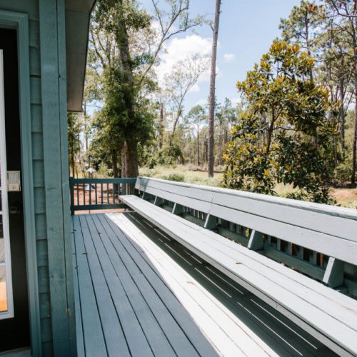 Start your mornings or wind down your evenings on this cozy deck, where built-in bench seating and wooded views welcome you home.