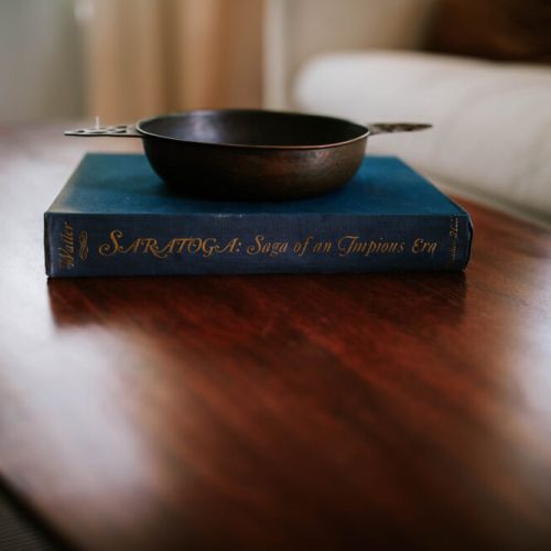 Enhance your lounging experience with our walnut wood center table, perfect for enjoying a game or simply relaxing in the living area.